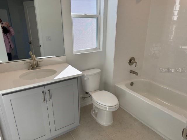 17727 Sharp Pummelo Alley Winter Garden, FL 34787 - Photo 19 of 19 a bathroom with a sink toilet and bathtub