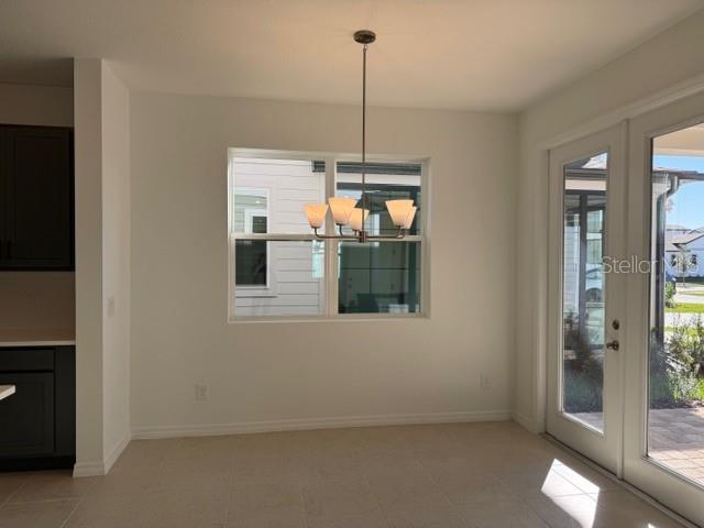 17727 Sharp Pummelo Alley Winter Garden, FL 34787 - Photo 3 of 19 a view of a room that has a window in it
