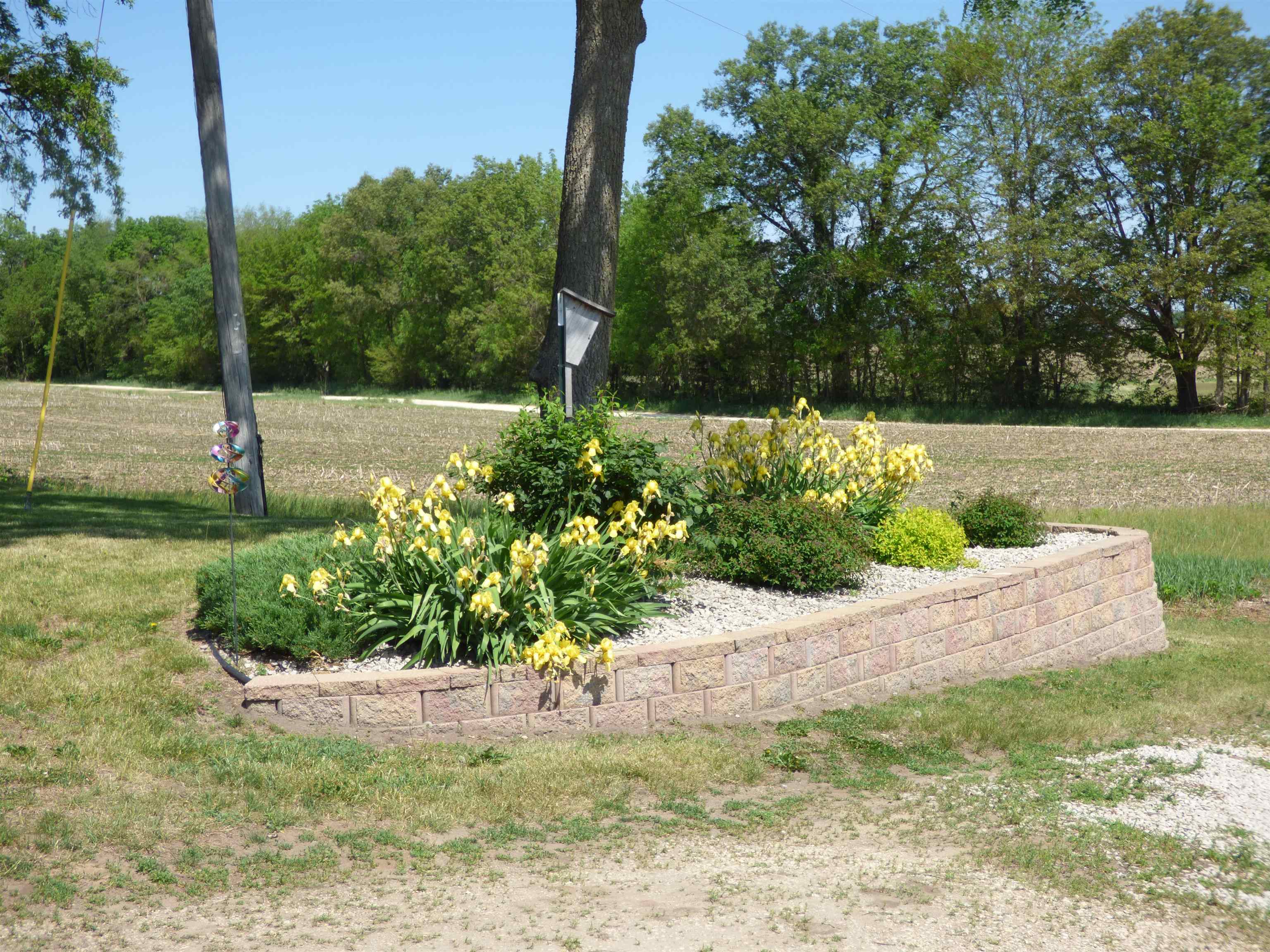 6384 A Diehl Road Savanna, IL 61074 - Photo 22 of 32 a view of a garden with potted plants