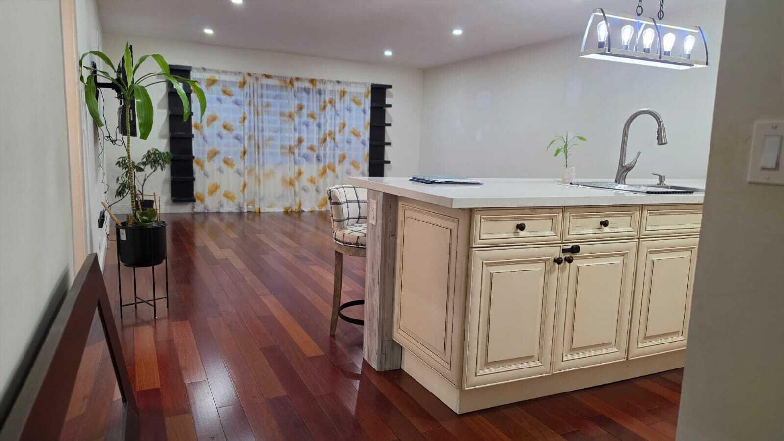 100 Ashbury Road, Unit 206 Hollywood, FL 33024 - Photo 12 of 23 a view of a hallway with wooden floor and staircase