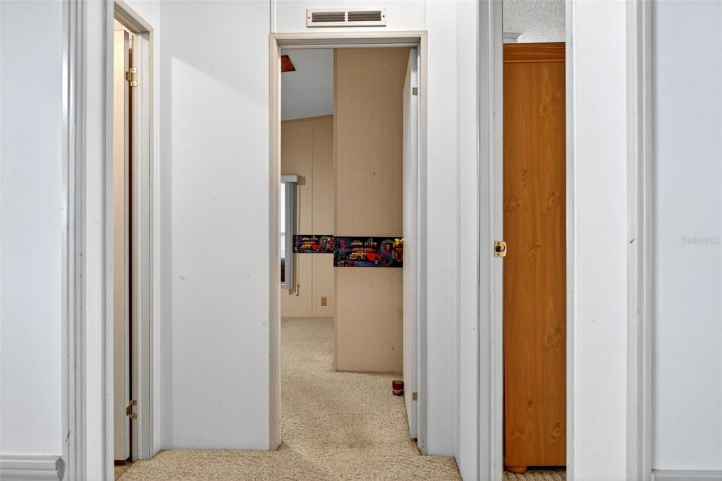 8046 Highpoint Boulevard Brooksville, FL 34613 - Photo 20 of 47 a view of a bathroom from a hallway