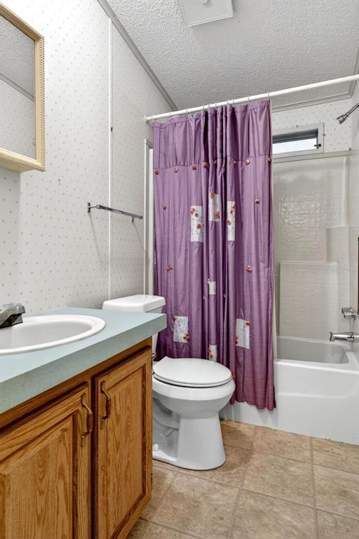 8046 Highpoint Boulevard Brooksville, FL 34613 - Photo 26 of 47 a bathroom with a sink a toilet and shower