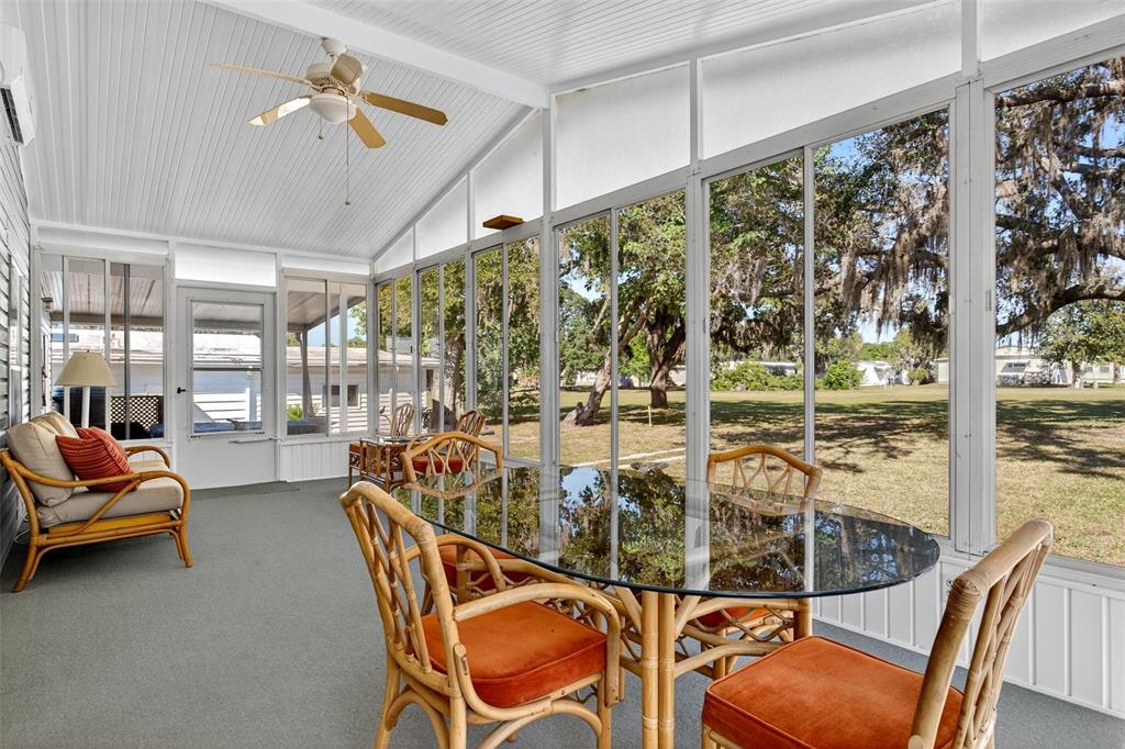 8046 Highpoint Boulevard Brooksville, FL 34613 - Photo 27 of 47 a view of a dining room with furniture water view and wooden floor