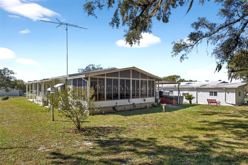 8046 Highpoint Boulevard Brooksville, FL 34613 - Photo 36 of 47 a view of a house with a yard