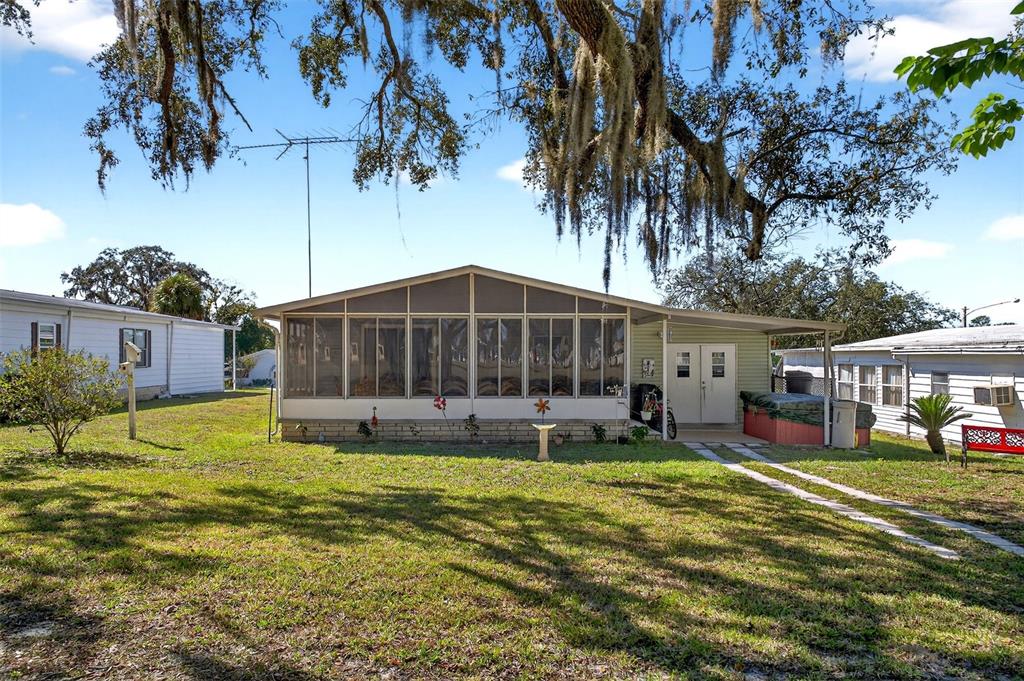 8046 Highpoint Boulevard Brooksville, FL 34613 - Photo 37 of 47 a view of a house with a yard patio and fire pit