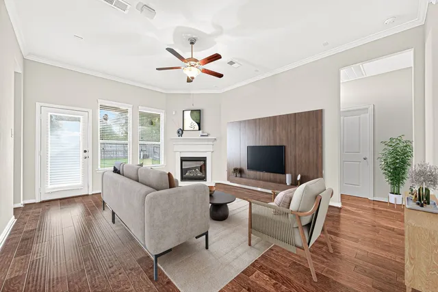 a living room with furniture and a fireplace