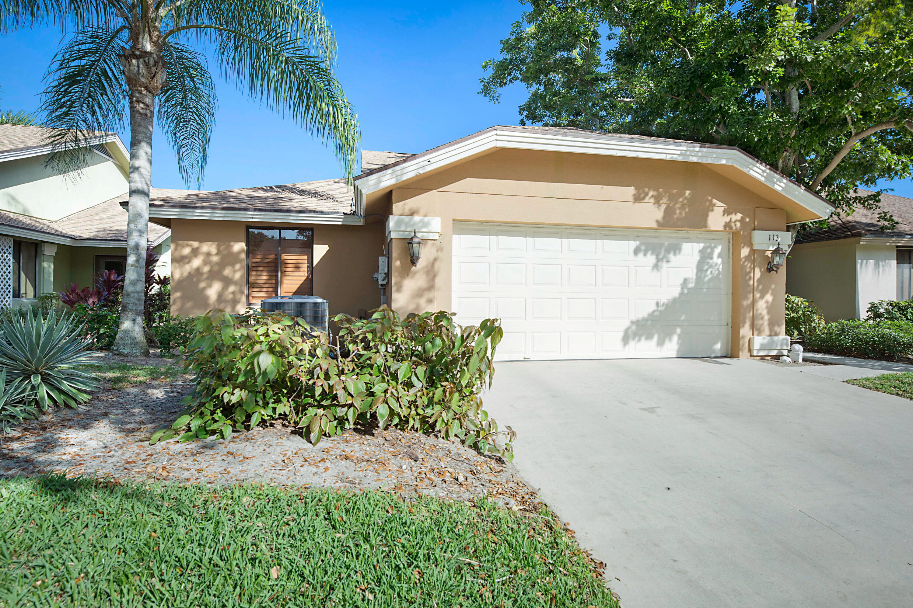 113 Seashore Drive Jupiter, FL 33477 - Photo 11 of 19 a front view of house with yard and green space
