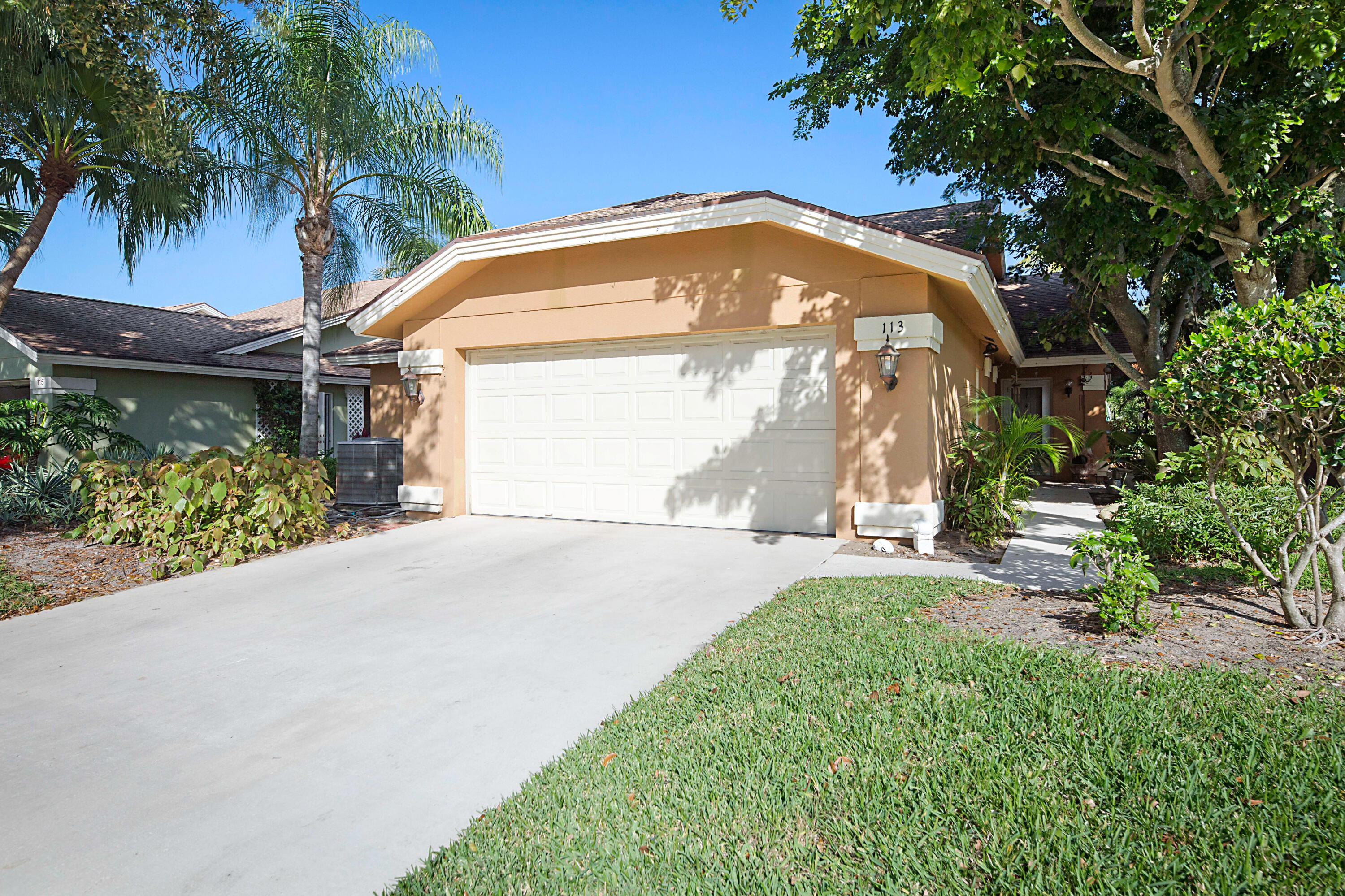 113 Seashore Drive Jupiter, FL 33477 - Photo 4 of 19 a view of a house with a yard