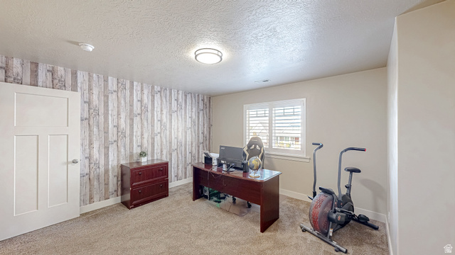 368 East 700 North Springville, UT 84663 - Photo 21 of 55 Home office with a textured ceiling, light carpet, an accent wall, wallpapered walls, and wooden walls