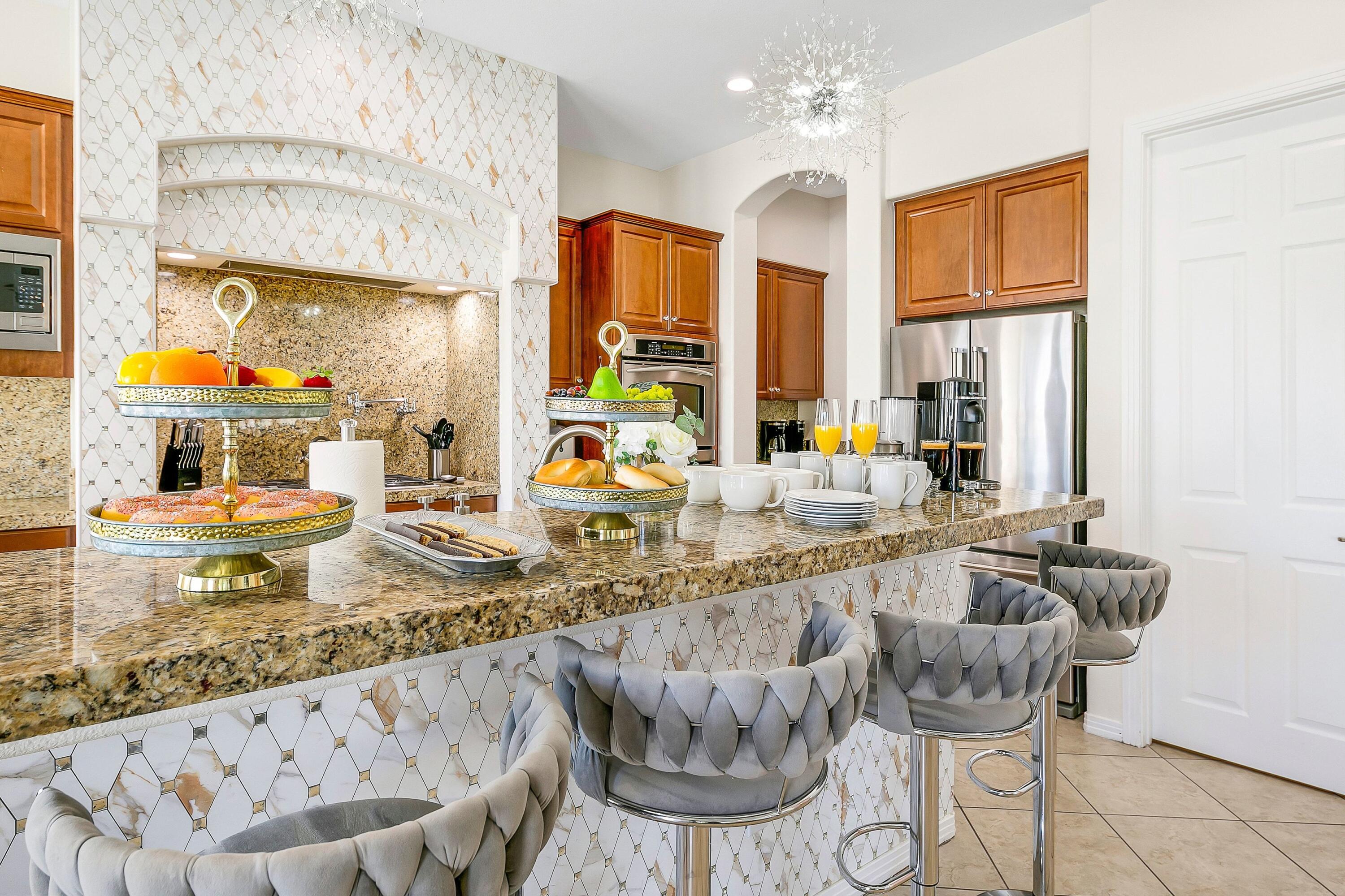 48678 Cascade Street Indio, CA 92201 - Photo 20 of 78 a large kitchen with granite countertop a sink and a wooden floor