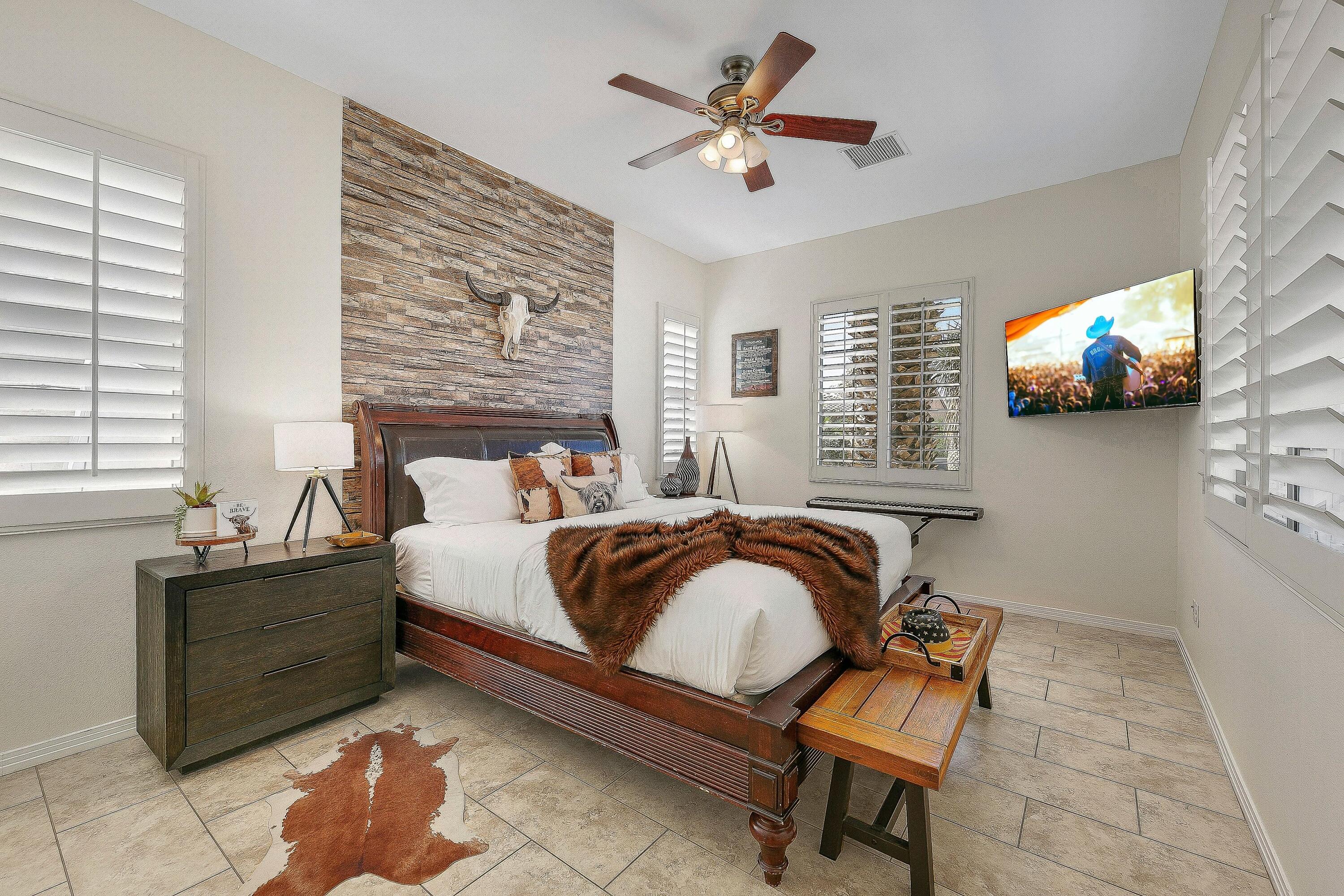 48678 Cascade Street Indio, CA 92201 - Photo 28 of 78 a bedroom with a bed and a flat screen tv