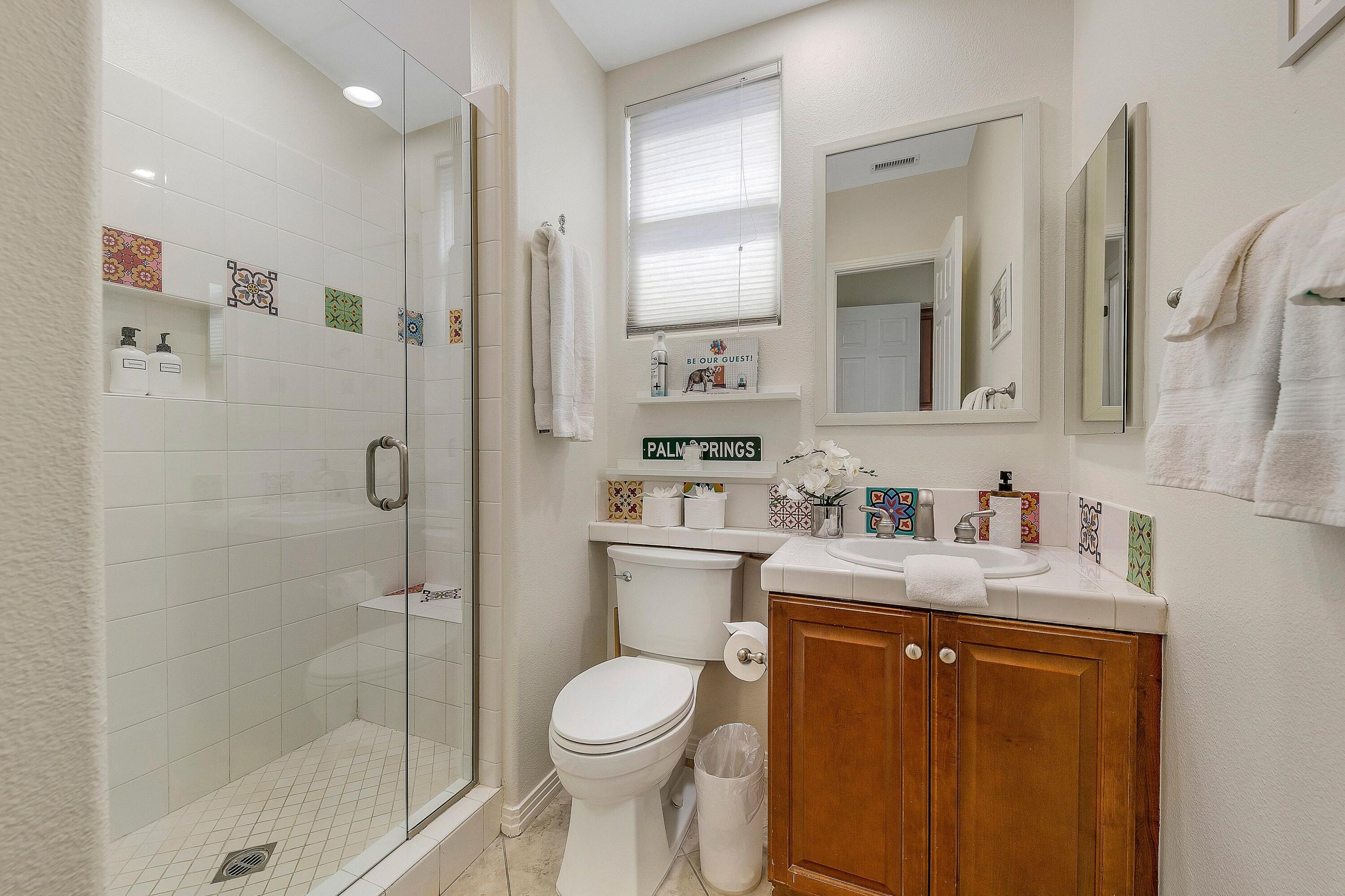 48678 Cascade Street Indio, CA 92201 - Photo 29 of 78 a bathroom with a granite countertop sink toilet and shower