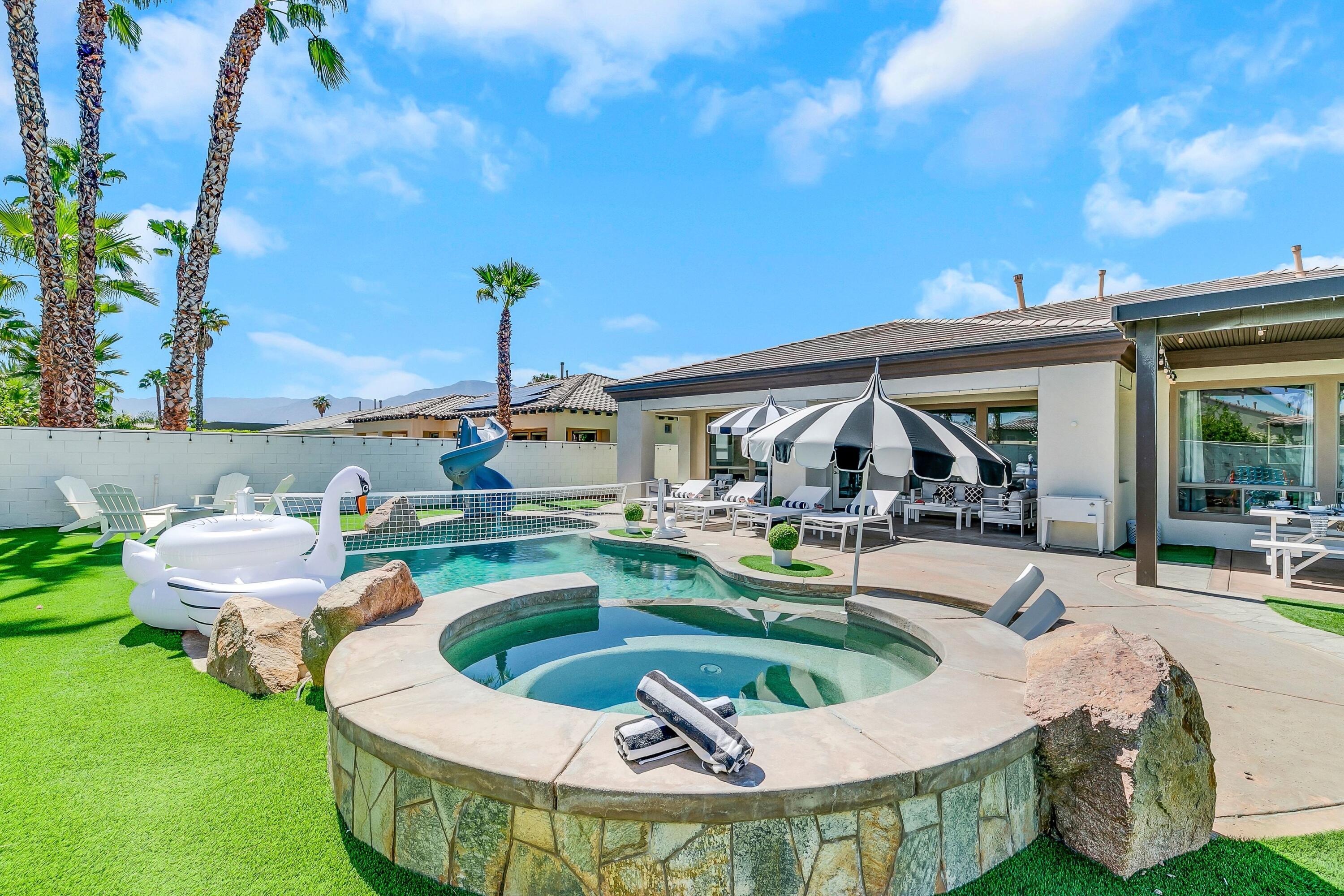 48678 Cascade Street Indio, CA 92201 - Photo 44 of 78 a view of a house with swimming pool and sitting area