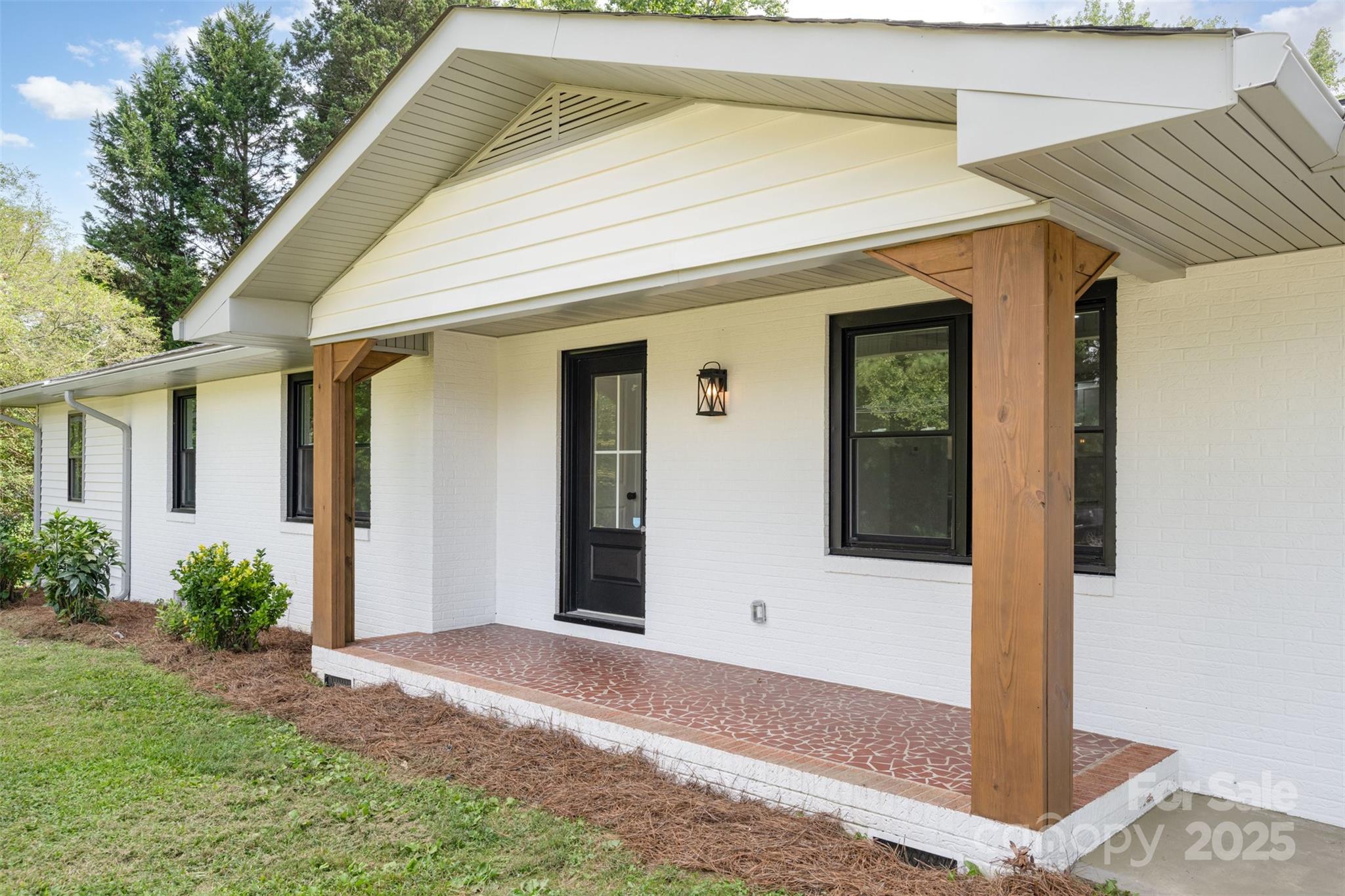 front view of a house with a small yard