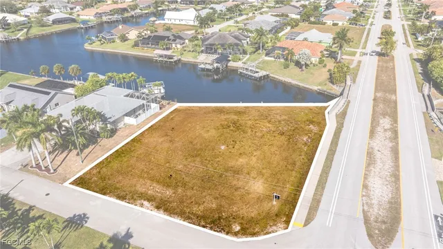 an aerial view of a house with a swimming pool
