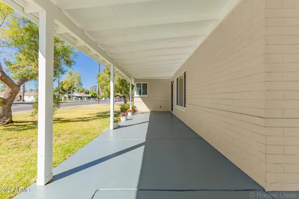 a bathroom with a granite countertop sink and shower