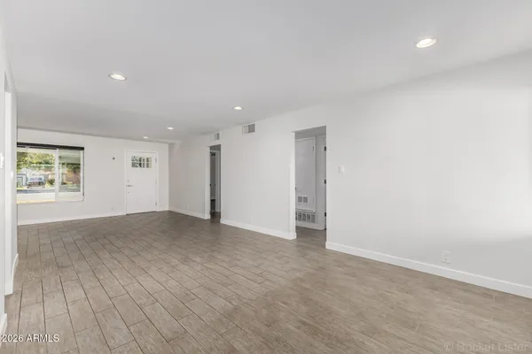 a view of an empty room with a window