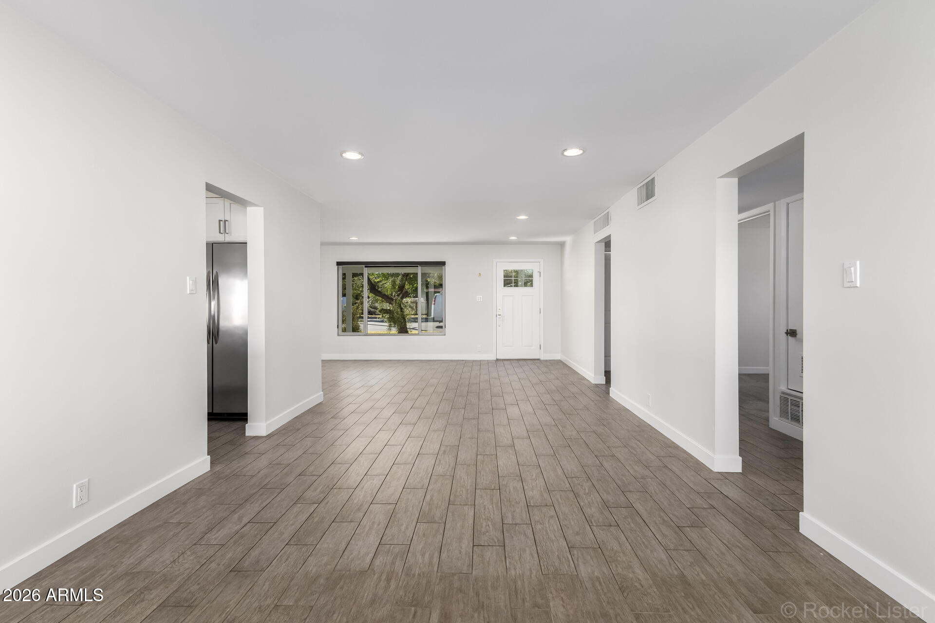 3930 East Oak Street Phoenix, AZ 85008 - Photo 22 of 61 a view of wooden floor and windows in a room