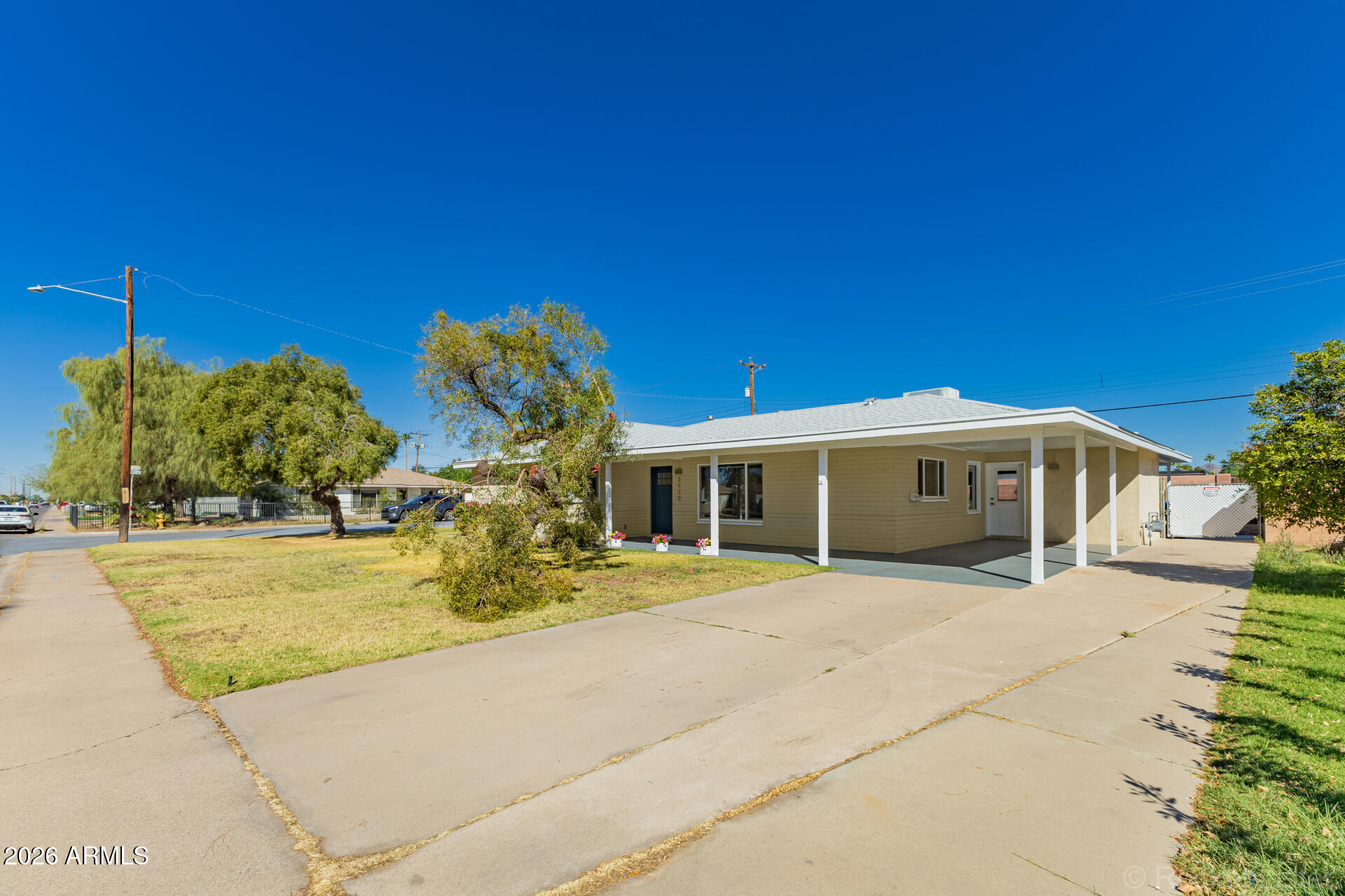 3930 East Oak Street Phoenix, AZ 85008 - Photo 57 of 61 a front view of a house with a yard and garage