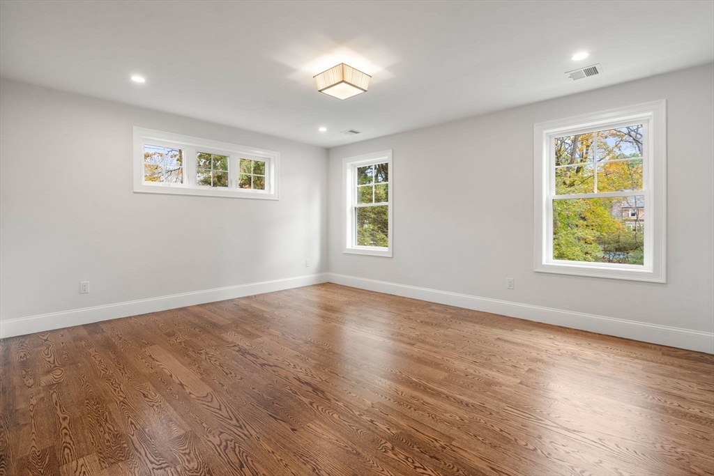 201 Lowell Road Wellesley, MA 02481 - Photo 26 of 42 a view of empty room with window and wooden floor