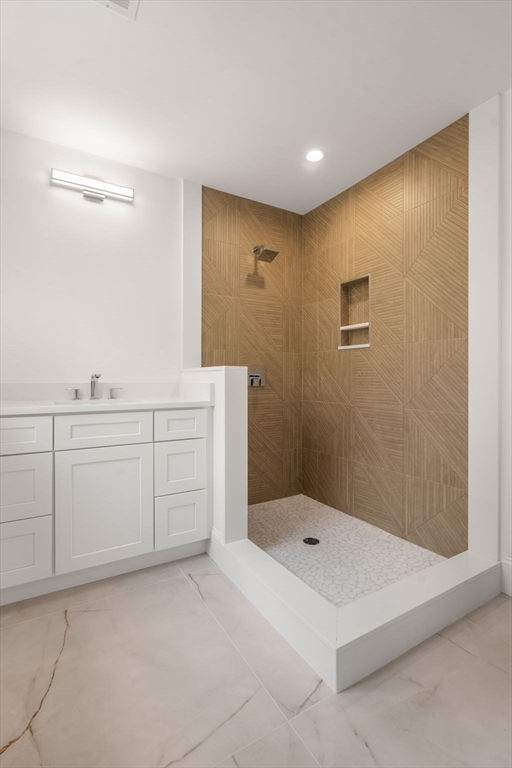201 Lowell Road Wellesley, MA 02481 - Photo 27 of 42 a bathroom with a tub sink and mirror