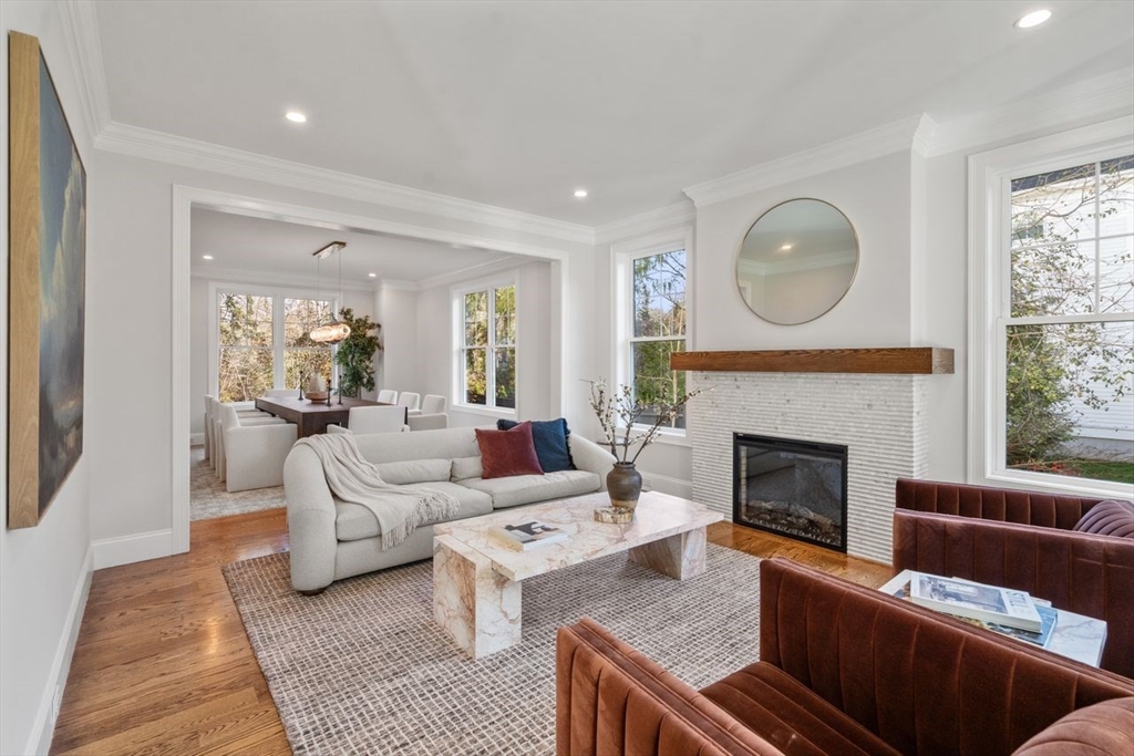 201 Lowell Road Wellesley, MA 02481 - Photo 29 of 41 a living room with furniture a fireplace and a large window