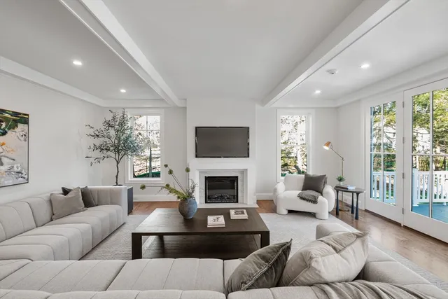 a work room with furniture and a potted plant