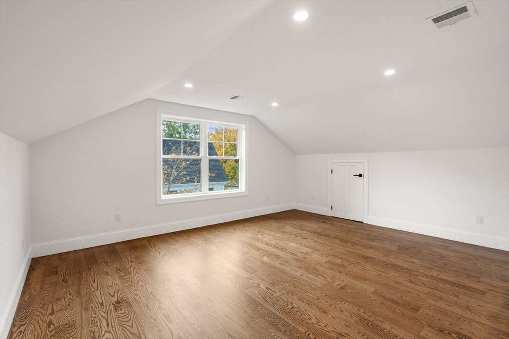 201 Lowell Road Wellesley, MA 02481 - Photo 34 of 42 a view of an empty room with wooden floor and a window