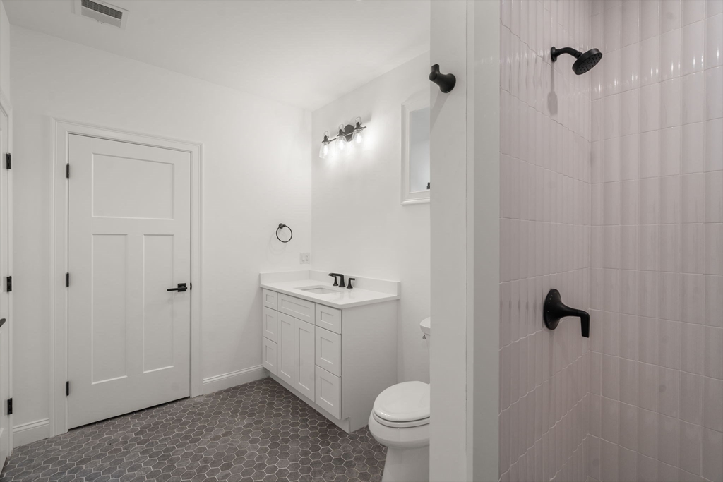 201 Lowell Road Wellesley, MA 02481 - Photo 40 of 42 a bathroom with a sink toilet and shower