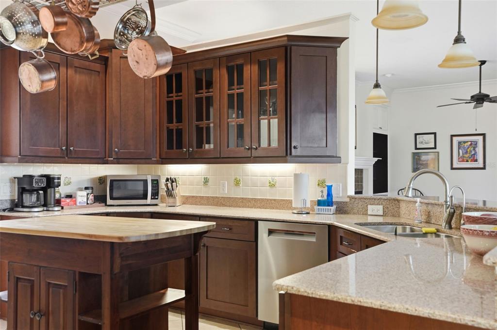 14228 Presteign Lane Spring Hill, FL 34609 - Photo 28 of 89 a kitchen with stainless steel appliances granite countertop a sink dishwasher stove and cabinets