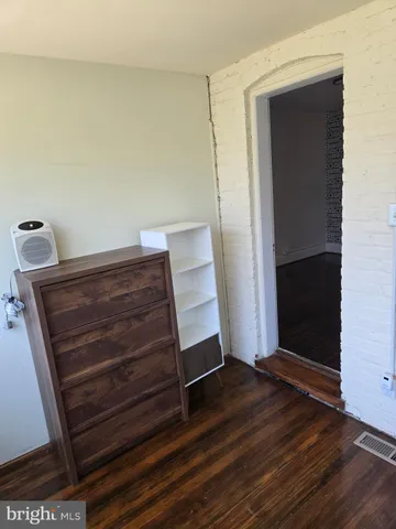 a view of room with wooden floor