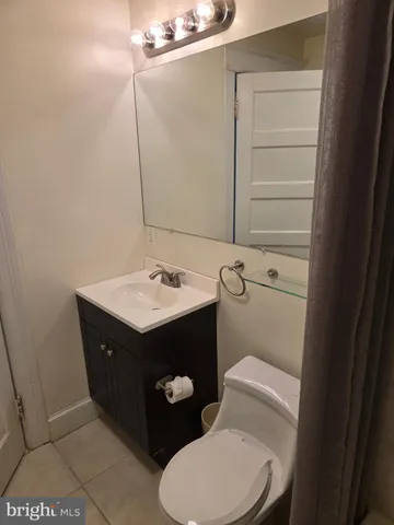 a bathroom with a sink toilet and vanity