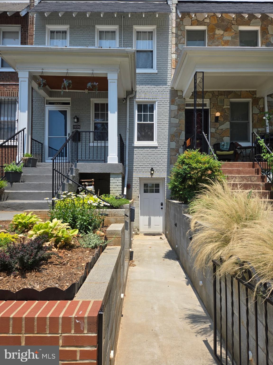 1278 Neal Street Northeast Washington, DC 20002 - Photo 2 of 22 a view of a house with potted plants