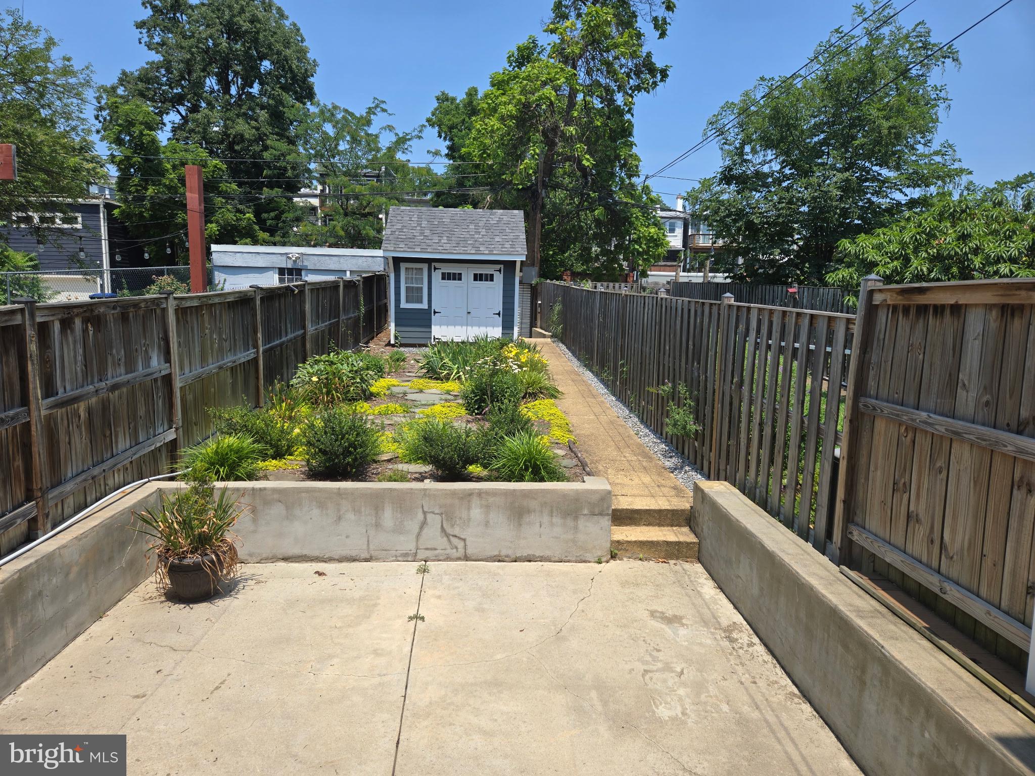 1278 Neal Street Northeast Washington, DC 20002 - Photo 21 of 22 a view of a garden with wooden fence