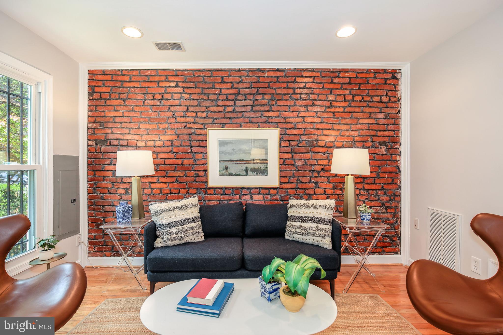 907 12th Street Southeast Washington, DC 20003 - Photo 3 of 24 Living room with exposed brick