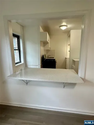 a bedroom with a bed and a mirror