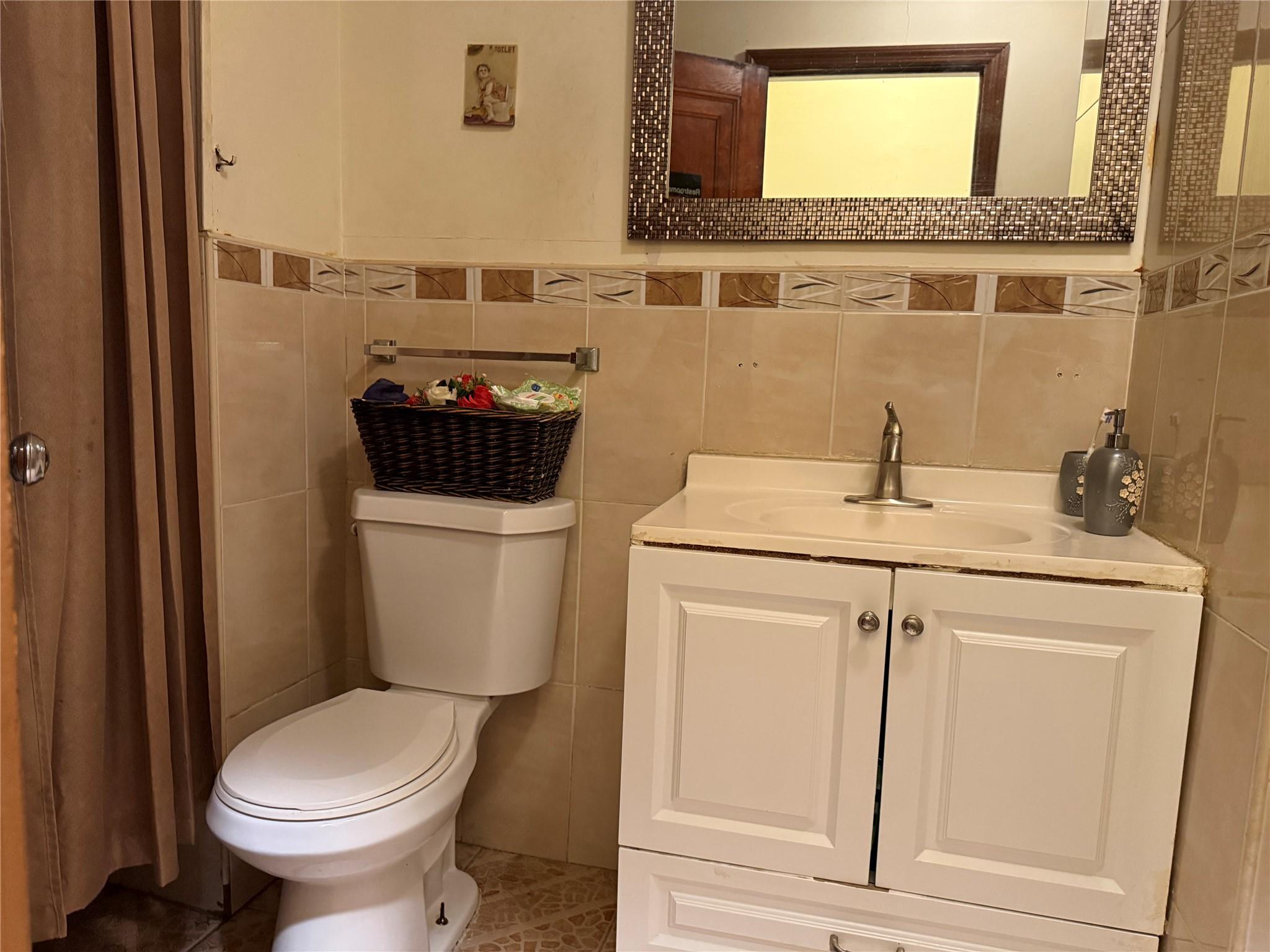 35-46 92nd Street Queens, NY 11372 - Photo 6 of 10 a bathroom with a sink and a toilet
