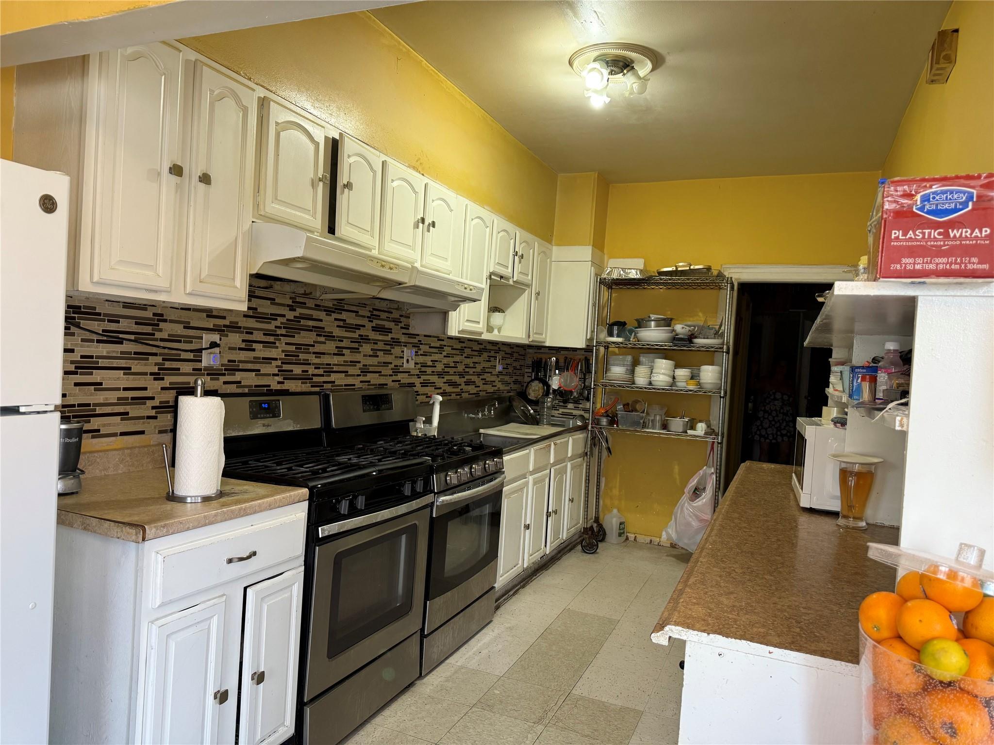 35-46 92nd Street Queens, NY 11372 - Photo 10 of 10 a kitchen with stainless steel appliances granite countertop a stove and a cabinets