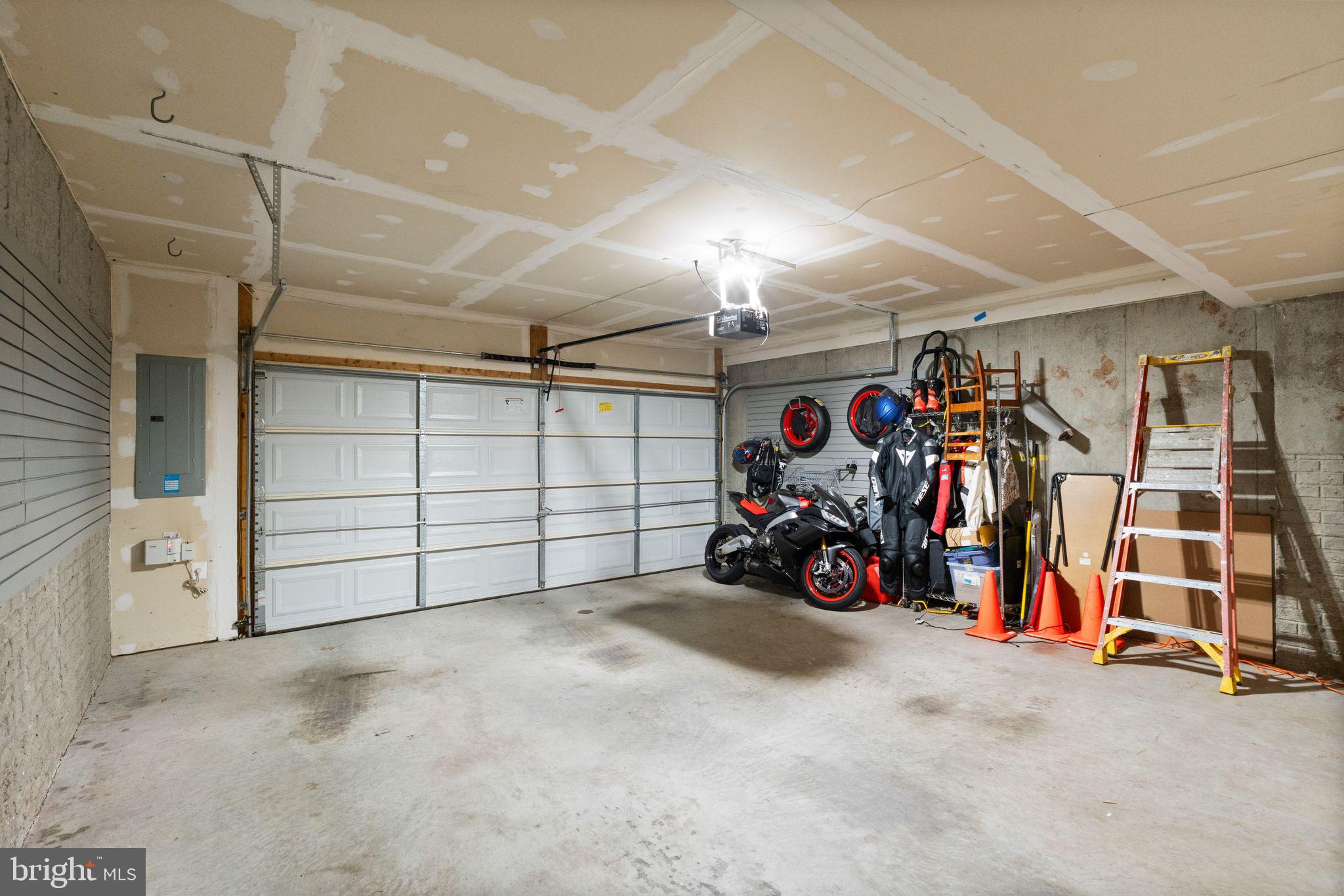 7015 Trek Way Gainesville, VA 20155 - Photo 47 of 56 2-car garage with slat-wall storage