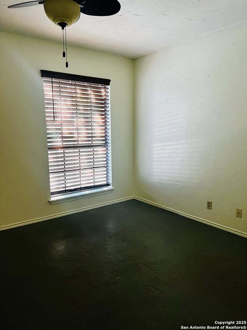 8655 Datapoint, Unit 404 San Antonio, TX 78229 - Photo 21 of 25 a view of an empty room with a window