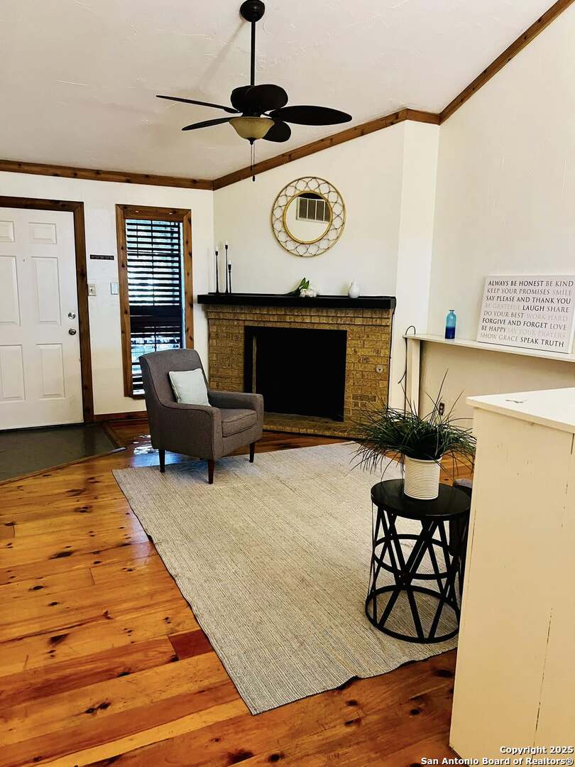 8655 Datapoint, Unit 404 San Antonio, TX 78229 - Photo 4 of 25 a living room with furniture and a fireplace