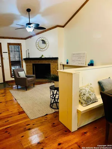 a living room with furniture and a fireplace