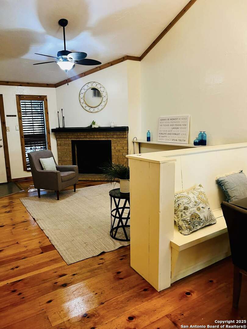 8655 Datapoint, Unit 404 San Antonio, TX 78229 - Photo 5 of 25 a living room with furniture and a fireplace