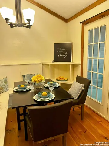 a view of a dining room with furniture and a table