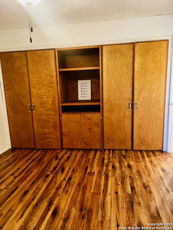 8655 Datapoint, Unit 404 San Antonio, TX 78229 - Photo 10 of 25 a view of an empty room with wooden door