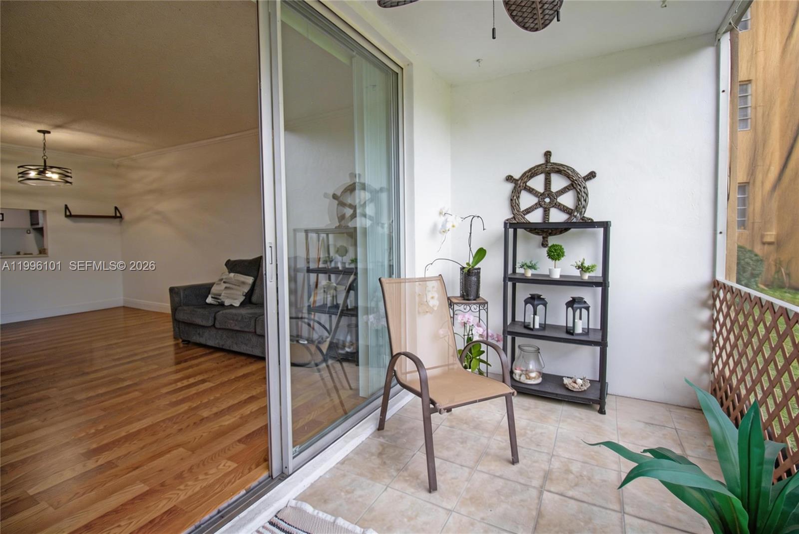 6020 Northwest 64th Avenue, Unit 108 Tamarac, FL 33319 - Photo 12 of 19 a bedroom with furniture and a book shelf
