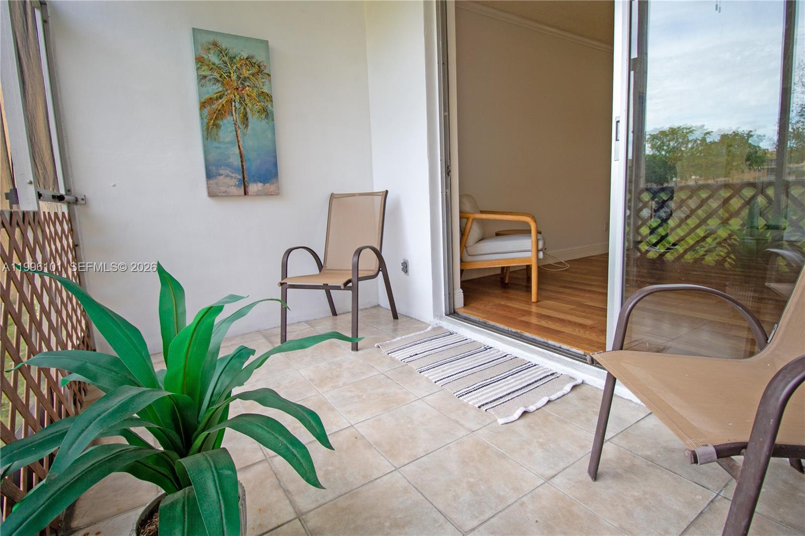 6020 Northwest 64th Avenue, Unit 108 Tamarac, FL 33319 - Photo 16 of 19 a bedroom with a bed and a window
