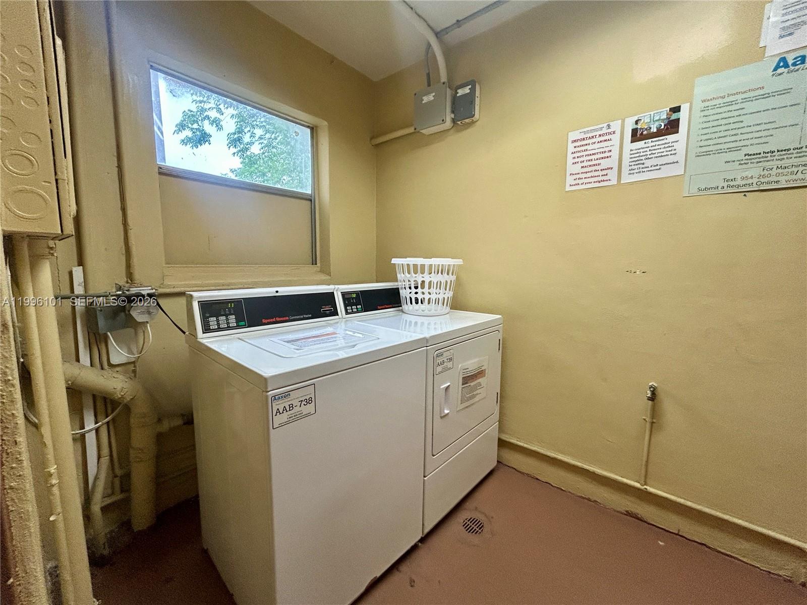 6020 Northwest 64th Avenue, Unit 108 Tamarac, FL 33319 - Photo 18 of 19 a utility room with dryer and washer