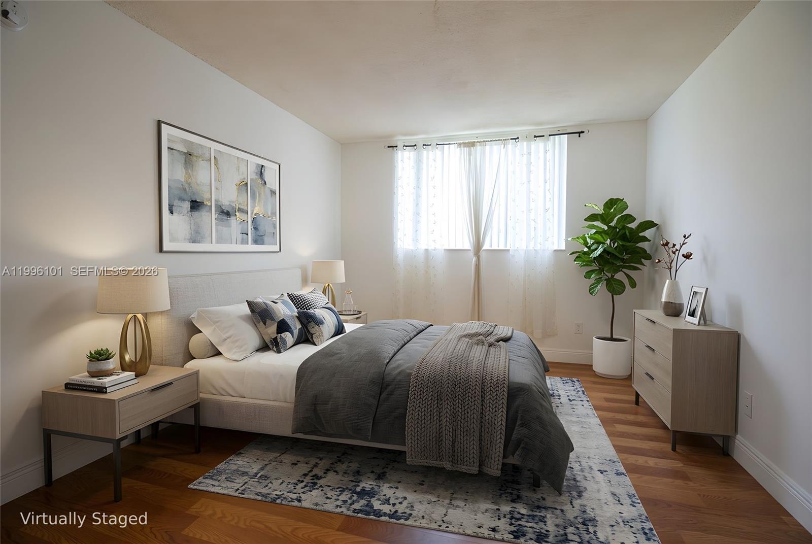 6020 Northwest 64th Avenue, Unit 108 Tamarac, FL 33319 - Photo 8 of 19 a bedroom with a bed and a potted plant