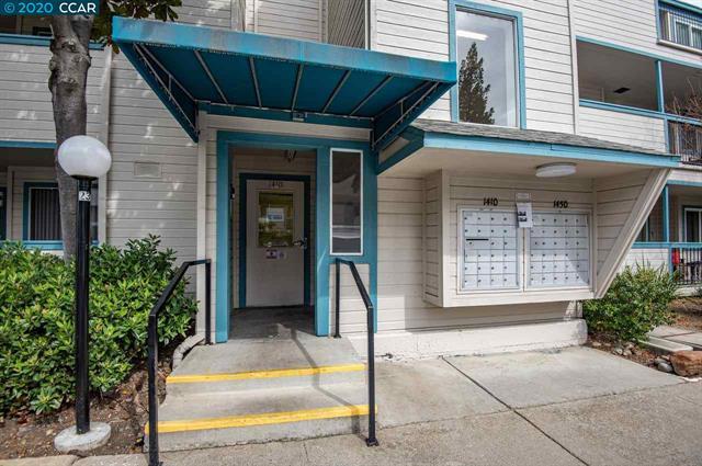 1410 Bel Air Drive, Unit 304 Concord, CA 94521 - Photo 2 of 23 a front view of a house with a yard